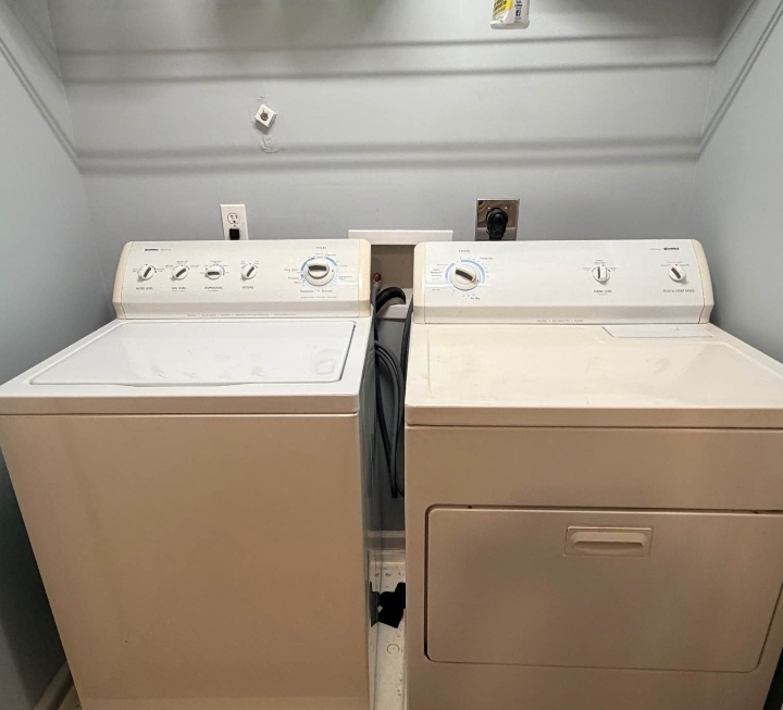 Washer and dryer set installed in a customer's laundry closet in the Triangle